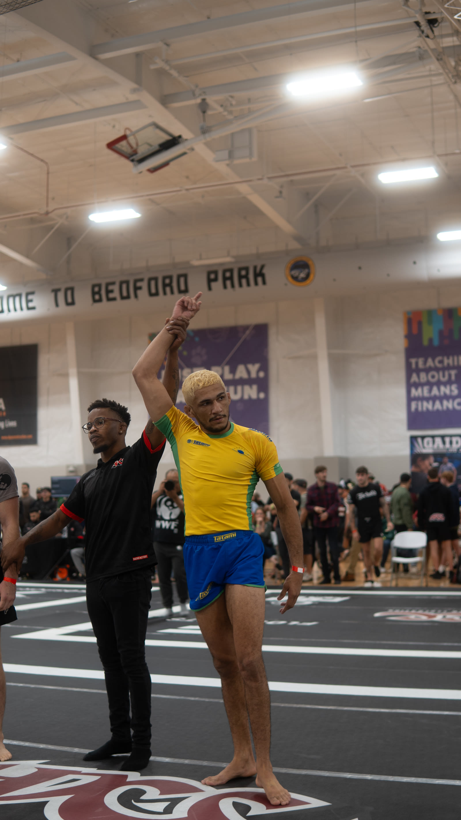 Wellington Andrade with his arm raised after a win.